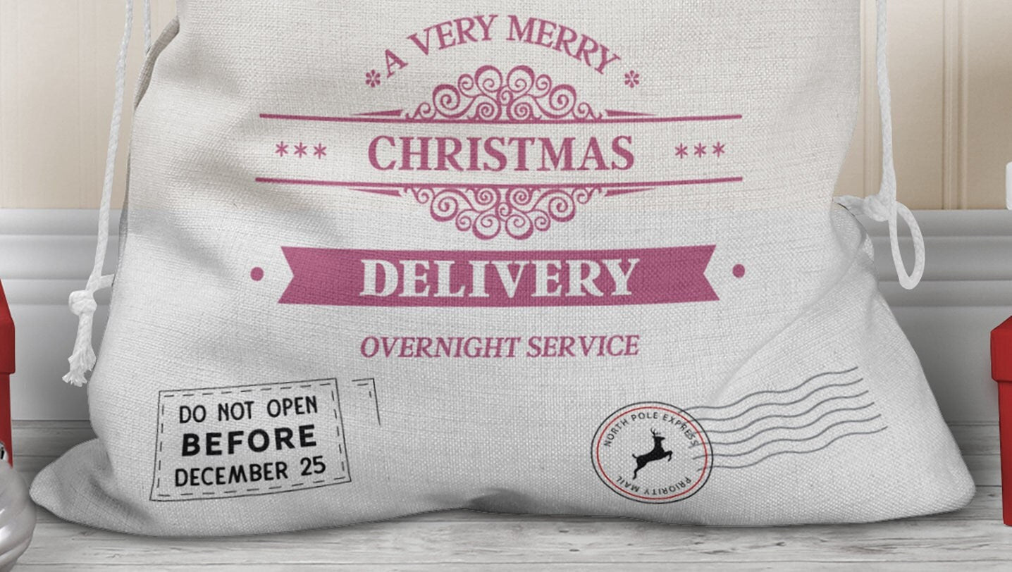 Close up of bottom of sack with words A very merry Christmas Delivery Overnight service and two North pole style delivery stamps one reads do not open before December 25th & the other is a simple round postage stamp with reindeer.