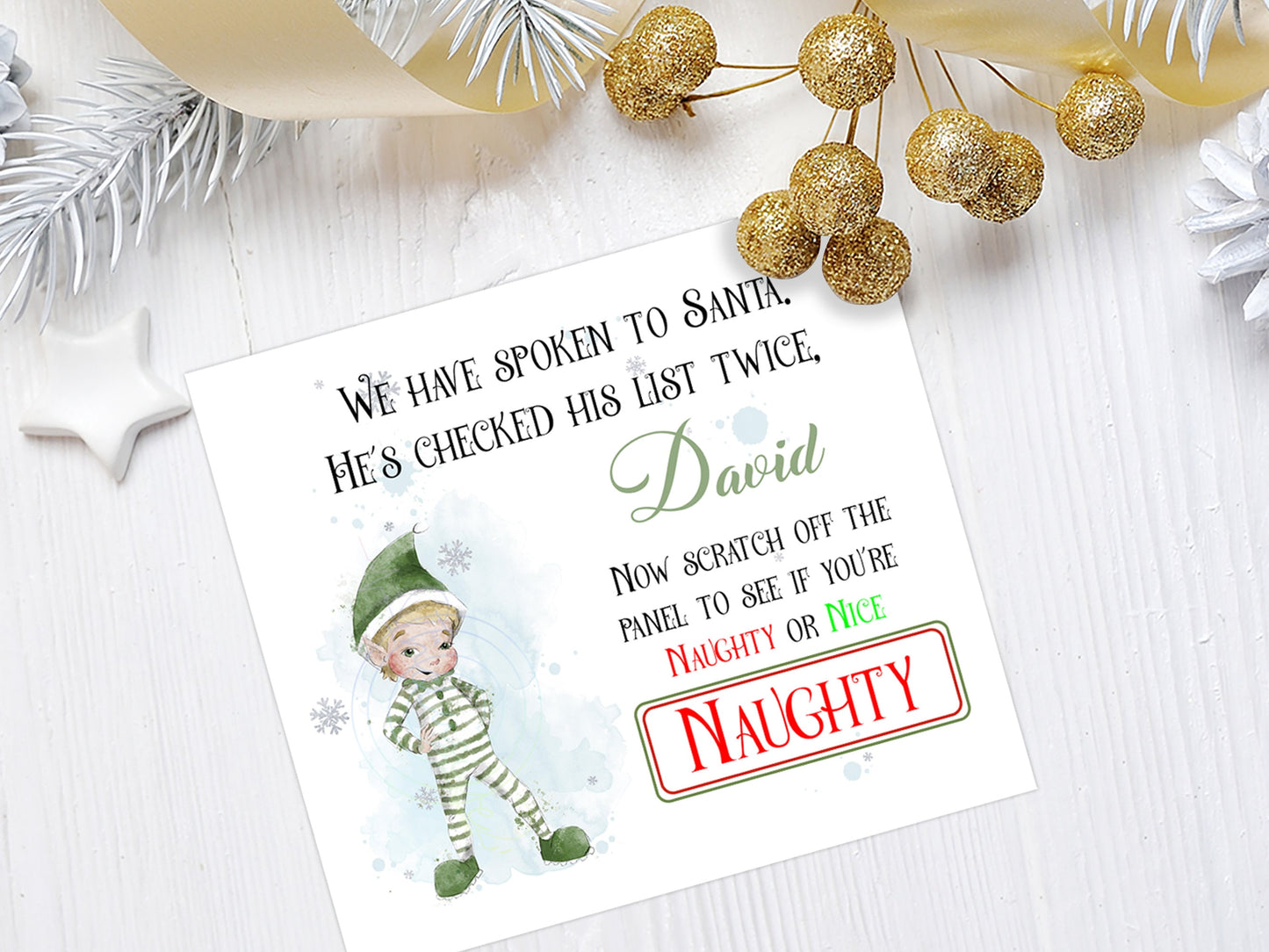 Elf Naughty or nice Scratch off card with male elf and silver scratch off panel to reveal the word Naughty or Nice  Reads We have spoken to Santa Hes checked his list twice Name Now scratch off the panel to see if you are Naughty or Nice