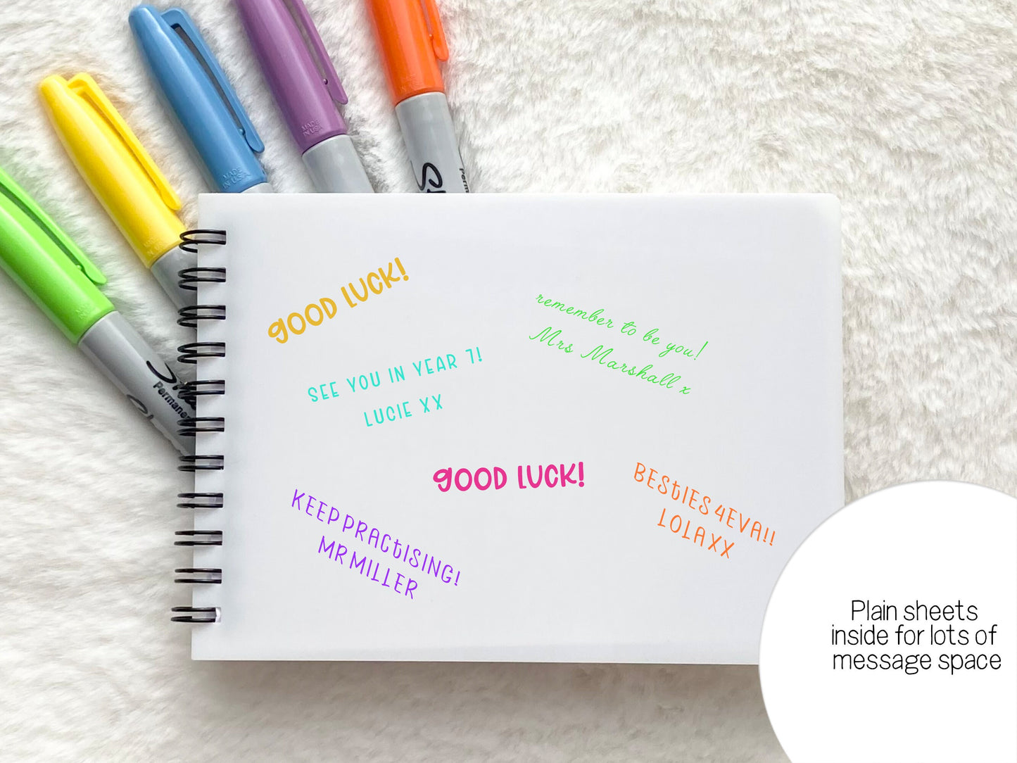 Plain white paper for those important autographs and messages. Spiral bound on left in black