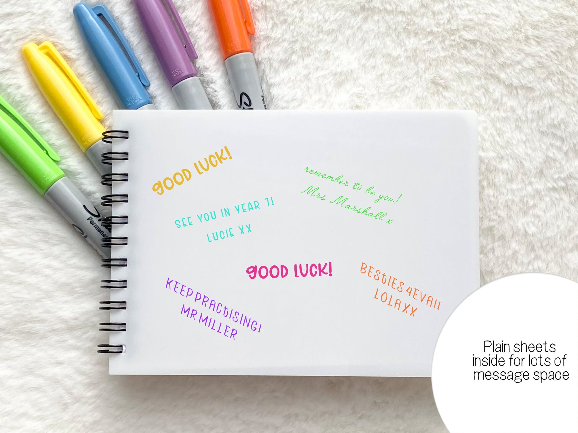 Plain white paper for those important autographs and messages. Spiral bound on left in black
