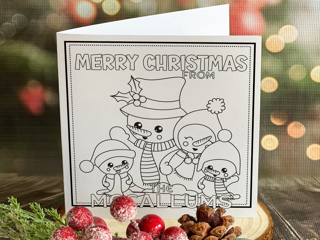 Colour your own White 5x5 inch sq card with black and white line drawing of Cute festive Snowman family Two adult & two small snowkids. Wordings reads Merry Christmas from Name)