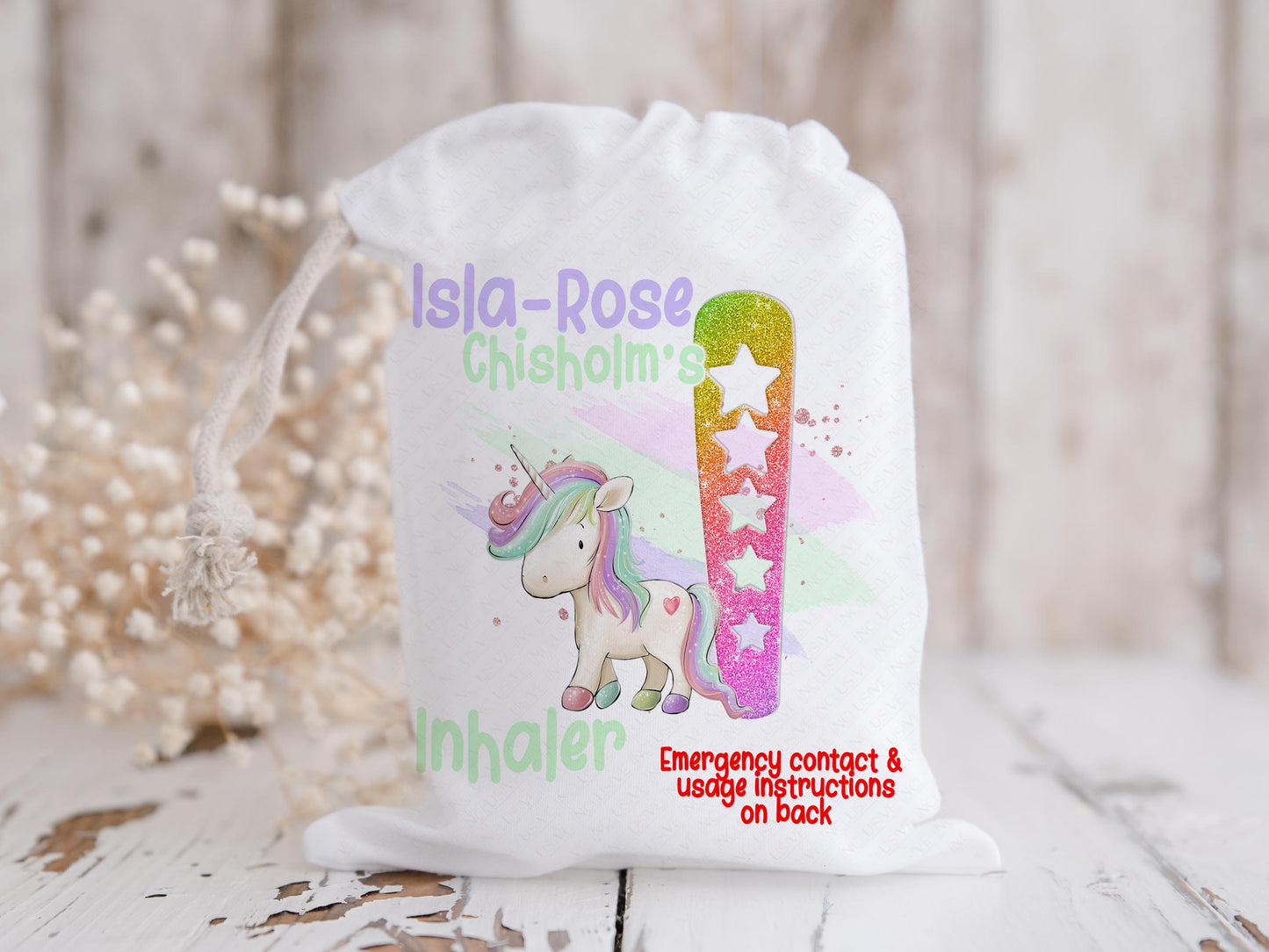 White drawstring bag with Magical Unicorn and initial letter in rainbow glitter colours. Bag shows Initial of first name and a character with text reading name inhaler if you choose to have emergency contact on back it will state this is available on the front.