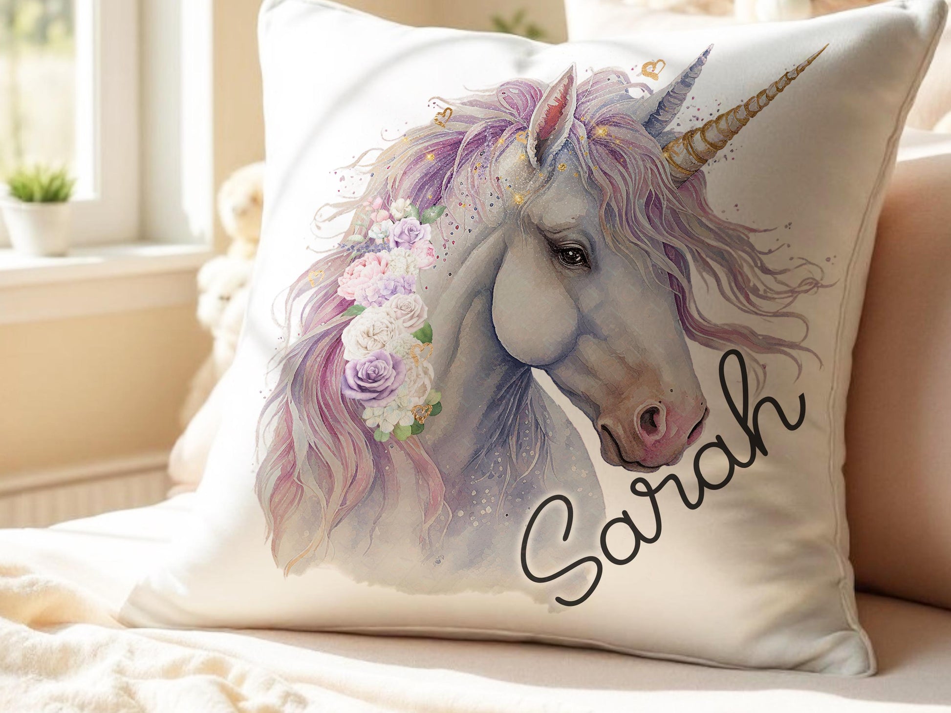 Personalised unicorn cushion with custom name ‘Sarah’, soft pillow cover with a printed white unicorn design with pastel mane and golden horn – perfect birthday gift for girls, granddaughter or niece.