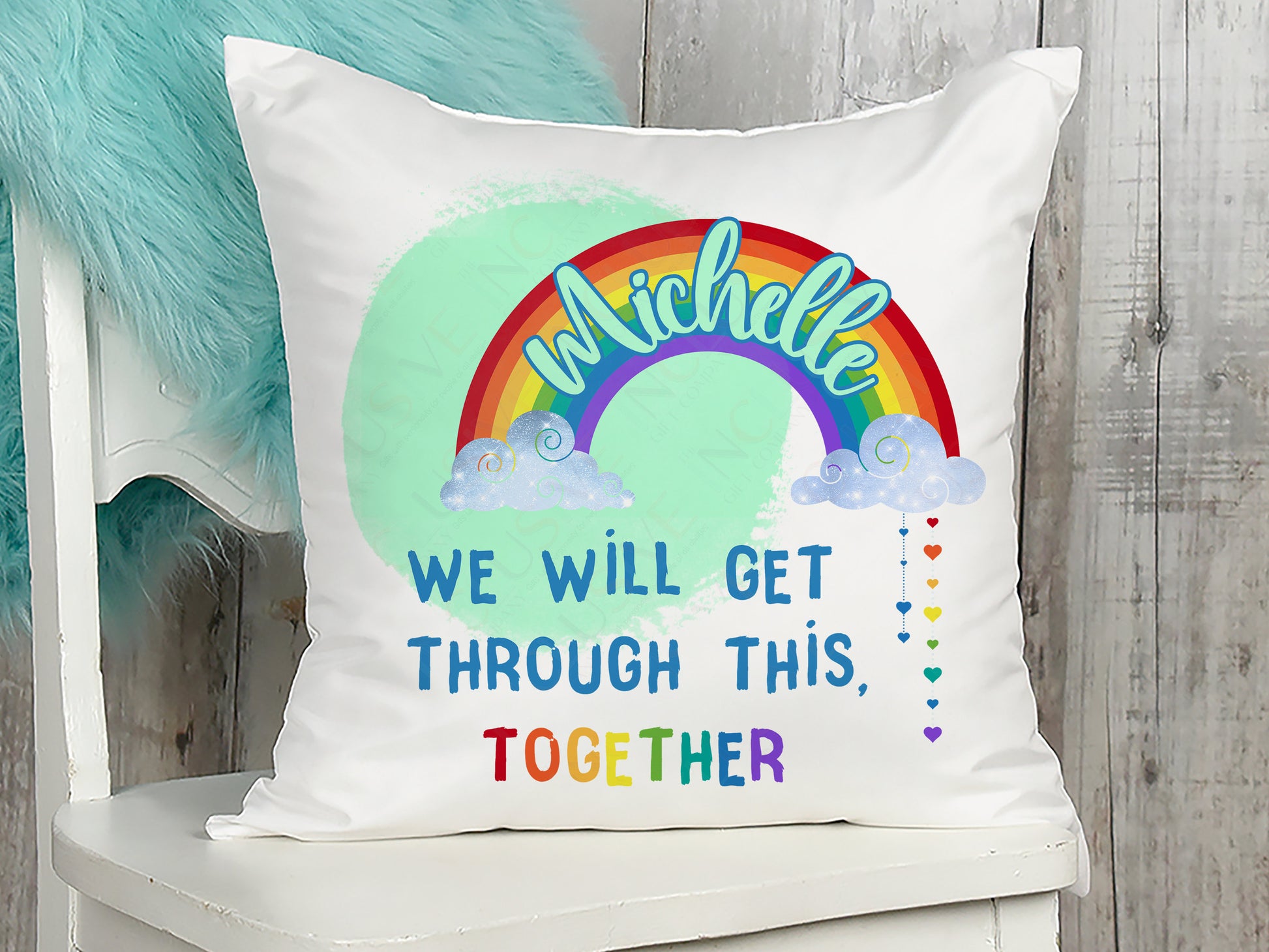 Plush white Cushion with vibrant printed rainbow and clouds with words we will get throughthis together. Add a name to the rainbow to personalise.
