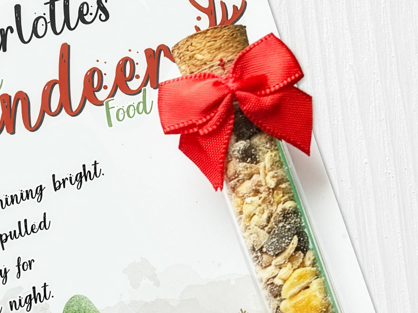Image shows a close up of the cork stopper closing on tube and a cute red bow