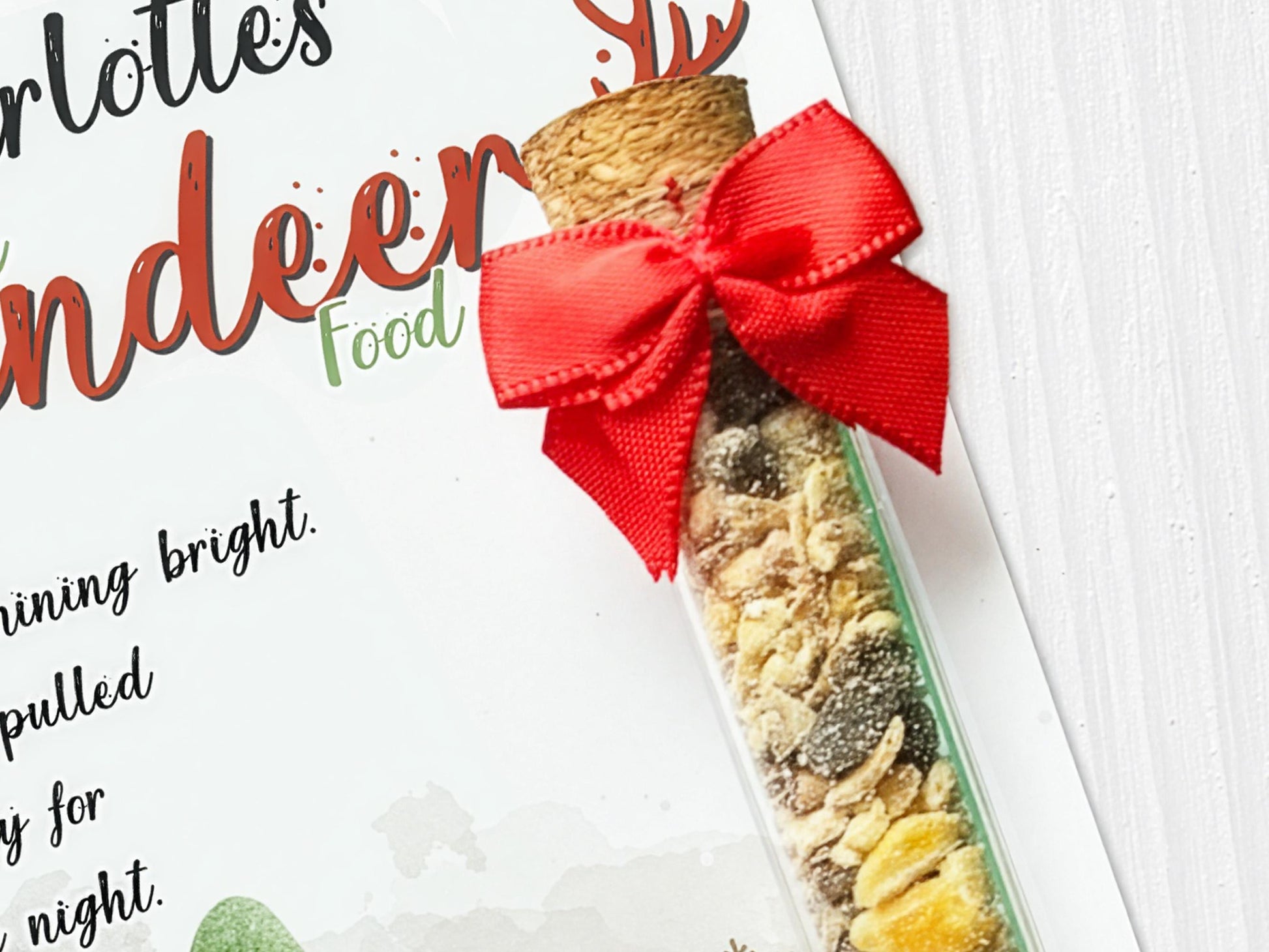 Image shows a close up of the cork stopper closing on tube and a cute red bow