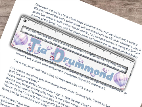 Dyslexia friendly reading ruler printed with a fun unicorn themed print thats personalised with any name. Balloons, clouds and cute Unicorn initials for the name make this a truely exciting and helpful aid Perfect for those with dyslexia, adhd or autism, helping to focus on smaller sections of text, preventing them from losing their place on the page and improving reading comprehension all whilst reducing stress. An optional 16.5cm ruler print at the top adds an extra use to the tool