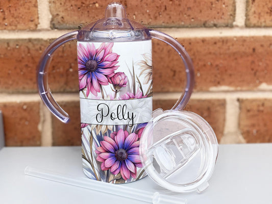 12oz insulated Sippy cup with spout and optional tumbler lid with straw for adults and children with disabilities. Printed with pink and purple daisys and personalised with any name.