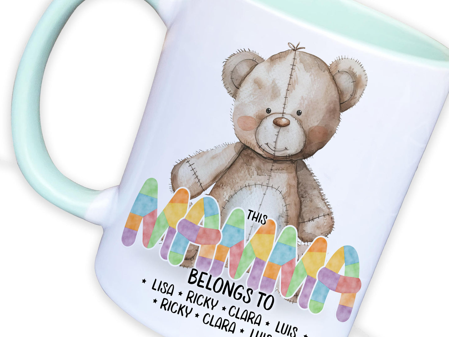 White ceramic mug with glossy Mint handle, rim and inner. Design shows A cute brown patchwork teddy bear and This Mum belongs too Names in coloured patchwork.

Personalised with as many names as you need