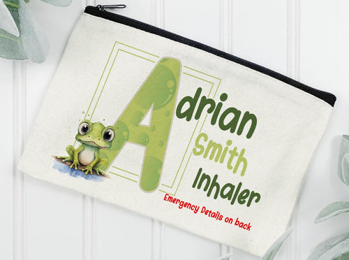 Cream Linen pouch with black zipper with my popular Frog sitting at the edge of a puddle of water & a green initial with bubble design inside the letter. Image above reads Adrian Smith Inhaler Emergency details on back. But can be changed to EpiPen, Medication etc