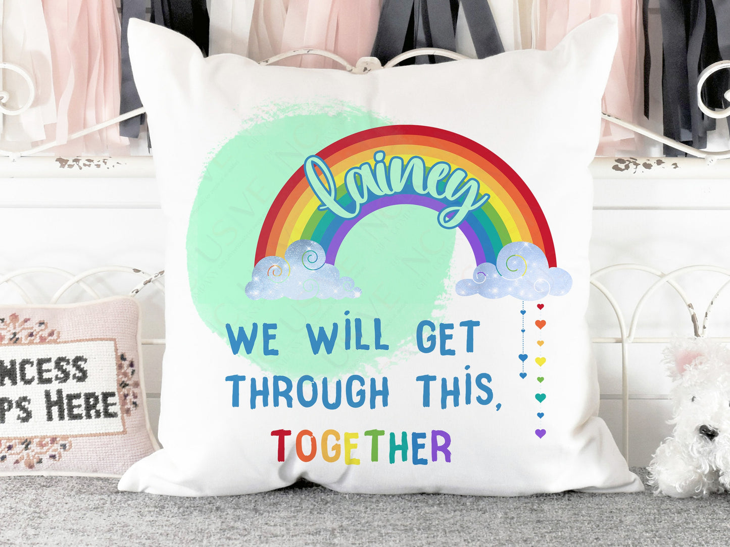 Plush white Cushion with vibrant printed rainbow and clouds with words we will get throughthis together. Add a name to the rainbow to personalise.