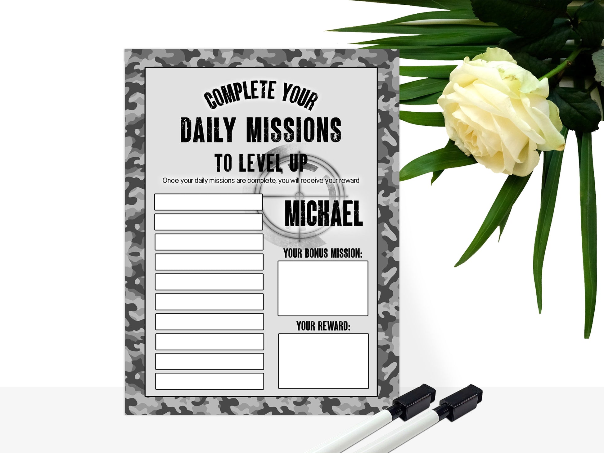 Grey Camo Printed sign, with shoot em up gamer style background and blank tasks and reward boxes for you to fill in. 

Text reads - Name Complete your daily missions to level up. Once your daily missions are complete you will receive your reward.