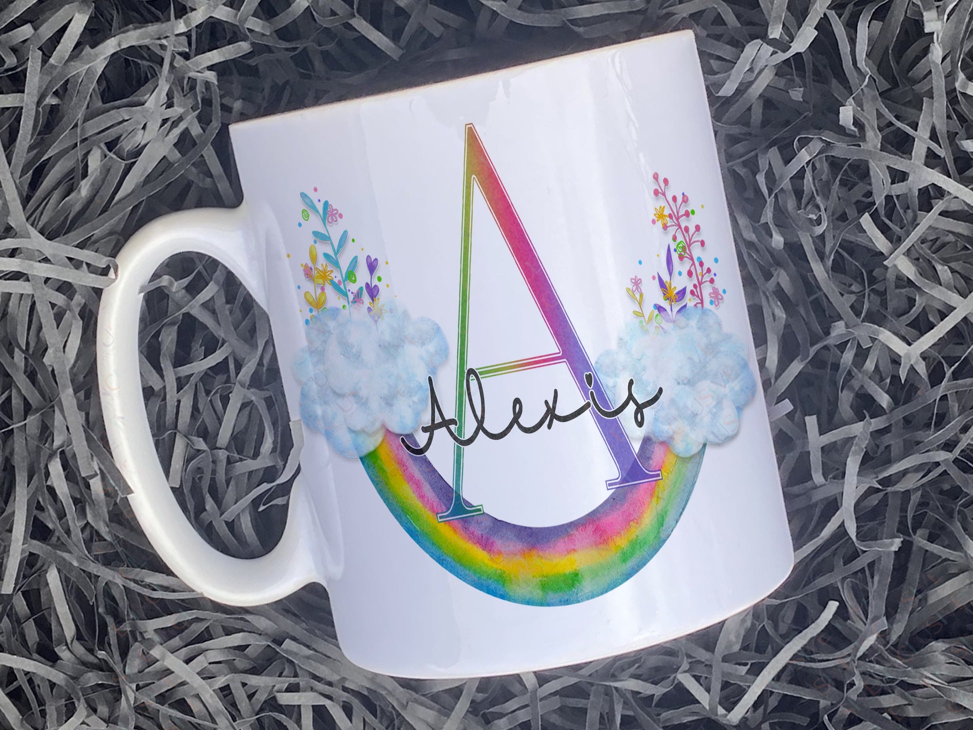 White ceramic mug with floral Upside down floral watercolour rainbow and matching initial and name.