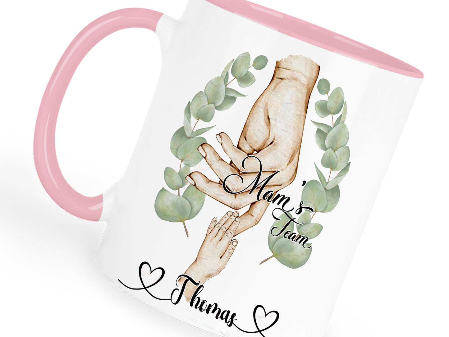 Ceramic mug with pastel pink handle and rim. Printed with watercolour style artwork of adult female hand and childrens hands