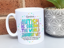 Load image into Gallery viewer, White Ceramic mug. Bright colourful rainbow wording reading Teachers name and Autism is seeing the world in a differnt way, thank you for helping me to explore my world love name
