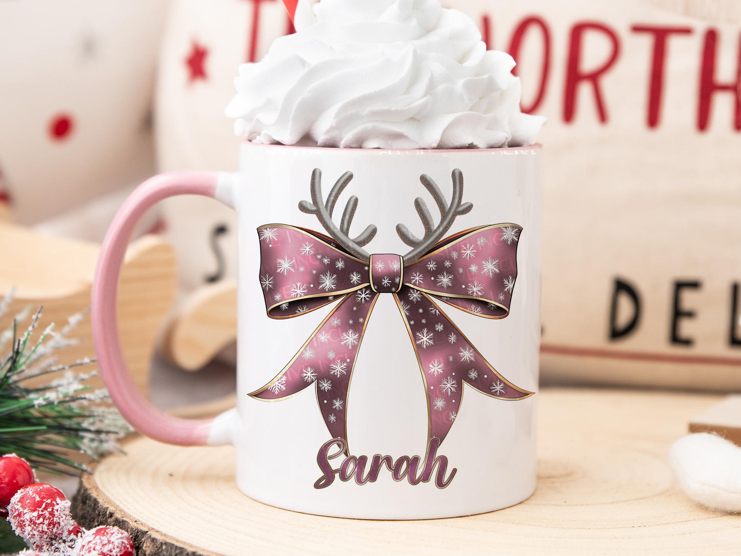 White Ceramic mug with a pink rim and handle printed with a Festive Pink & Gold bow Topped with Glittery Reindeer Antlers with matching Name. Personalised with any name and printed on both sides. Bows also available in Green, Dark blue, Light Blue and Red