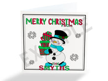Load image into Gallery viewer, Colour your own White 5x5 inch sq card with black and white line drawing of Cute festive Snowman carrying 3 boxed gifts and surrounded by snowflakes. Wordings reads Merry Christmas from Name)
