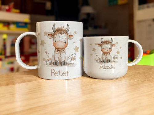 Designed with little hands in mind, this white shatterproof polymer cup is printed with a boho watercolour inspired cow design. Both Durable and safe for everyday use by even the most clumsy toddler, whether they’re sipping their favorite drink or using it as a fun, decorative piece and personalised with their name, it’s sure to bring joy to your little farmyard fan. Choice of two sizes makes it a great gift whatever their age and ability.