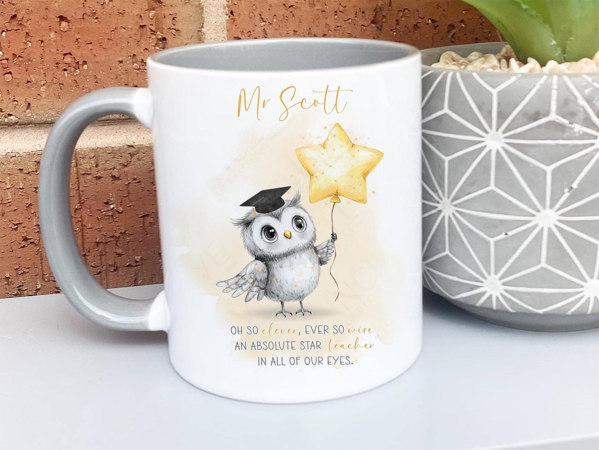 A white mug with grey rim and handle. An adorable owl with a teacher cap holding a gold balloon design and Grey and gold verse is printed directly on the mug so will not fade. Available with or without personalisation.
Verse reads 
Name. 
Oh so clever, ever so wise 
an absolute star teacher
in all of our eyes.