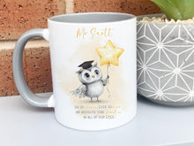 Load image into Gallery viewer, A white mug with grey rim and handle. An adorable owl with a teacher cap holding a gold balloon design and Grey and gold verse is printed directly on the mug so will not fade. Available with or without personalisation.
Verse reads 
Name. 
Oh so clever, ever so wise 
an absolute star teacher
in all of our eyes.
