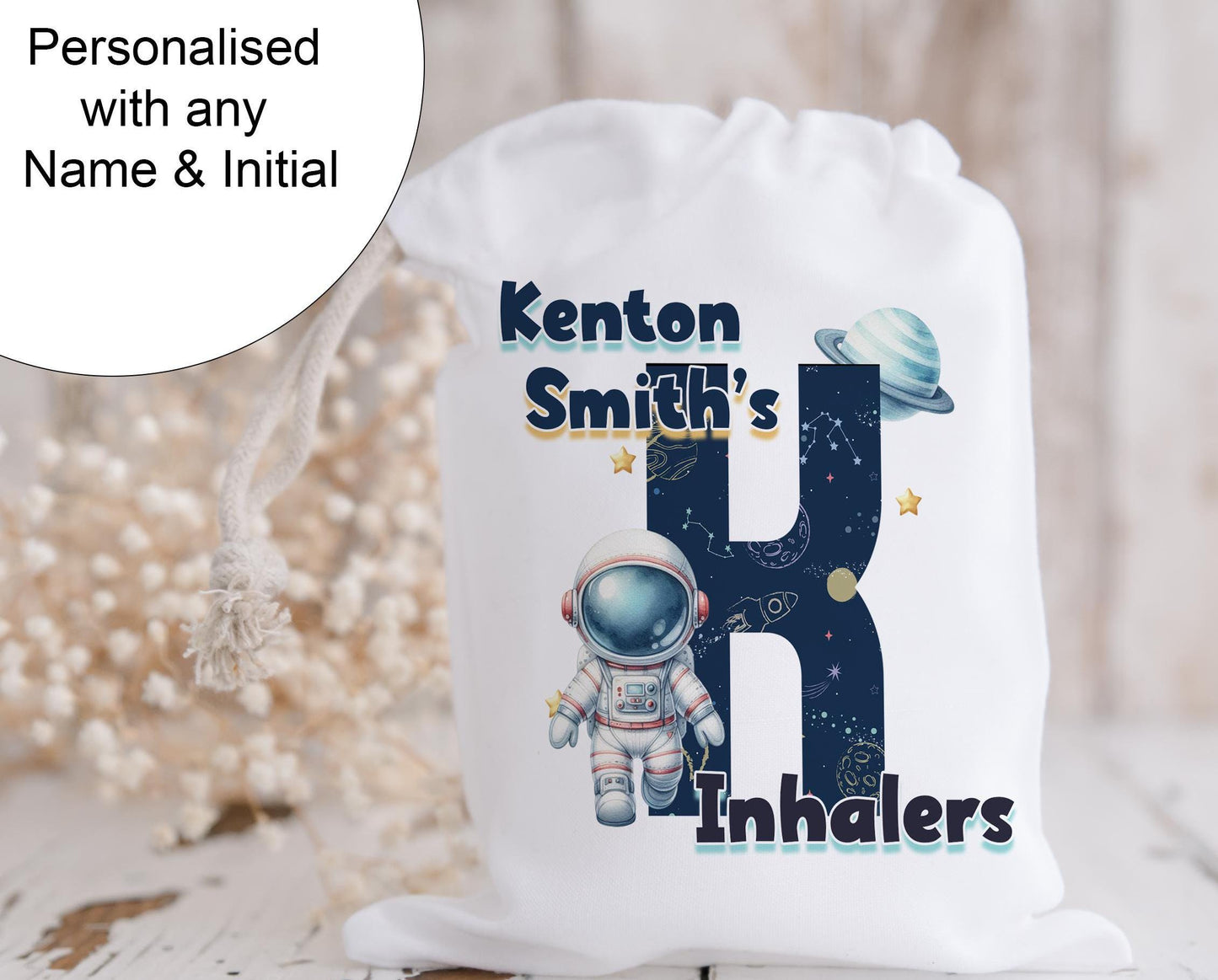 Personalised with any name

White drawstring bag. This image shows a Space theme letter and matching Text that says Names inhalers.