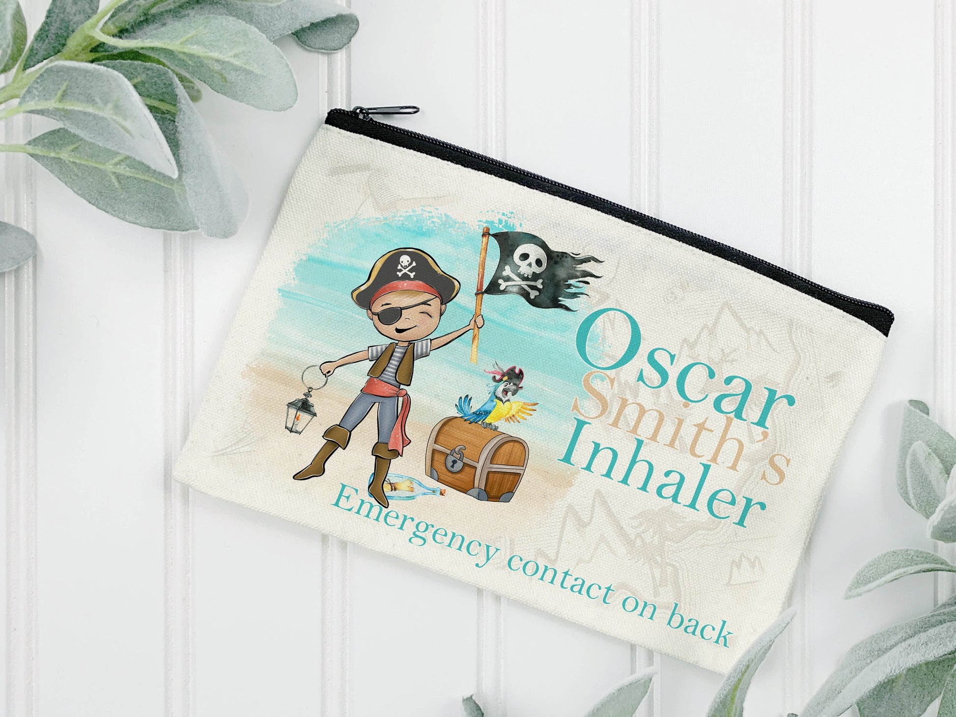 Cream Linen pouch with black zipper with a masculine pirate wearing a pirate hat with flag standing on the beach with chest and parrot. Text reads Name's inhaler.