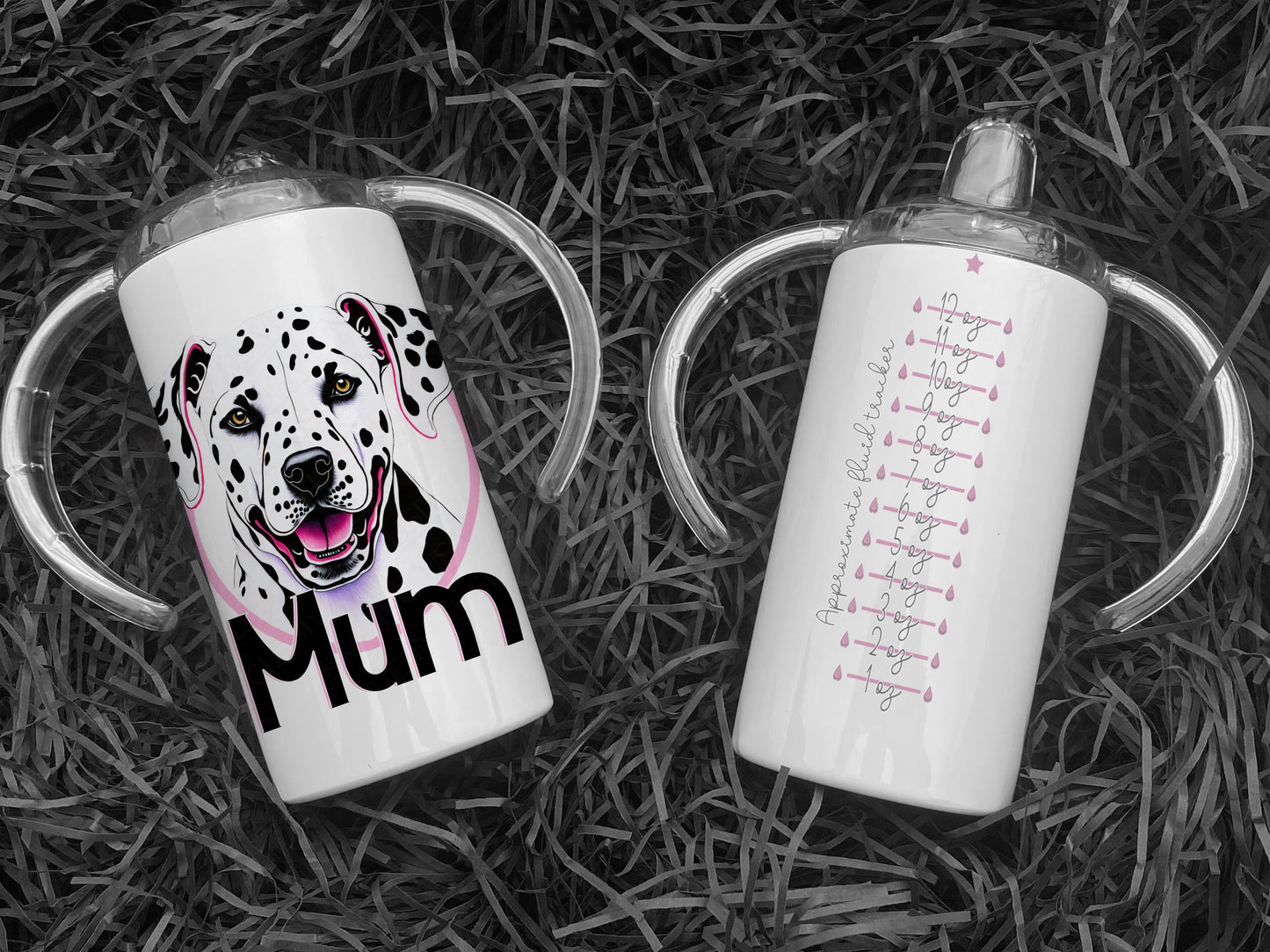 Front of mug is printed with Dalmatian dog face print and name in matching black and pink. Back of cup is printed with an approximate 12 oz fluid guide in pink