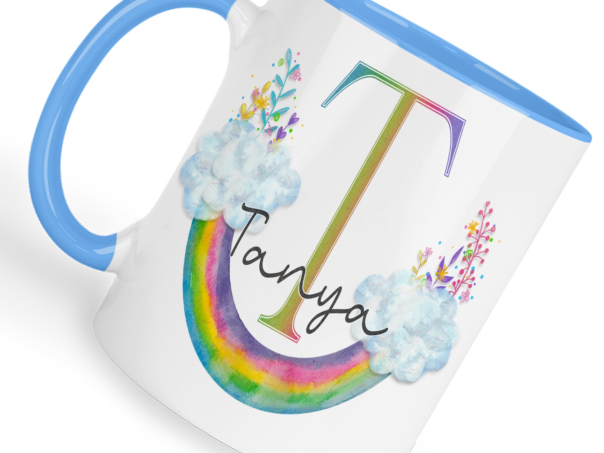 White with blue handle and rim ceramic mug with floral Upside down floral watercolour rainbow and matching initial and name.