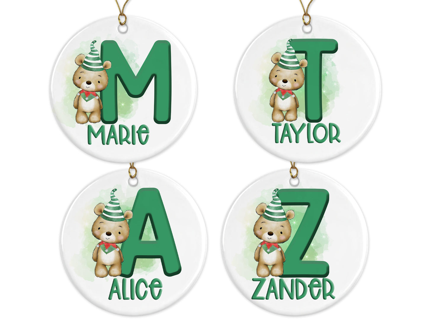 White ceramic bauble with Green letter with Cute brown teddy dressed in green and white striped hat and green and red elf collar.  Name written across the bottom in matching Green with gold cord to hang.