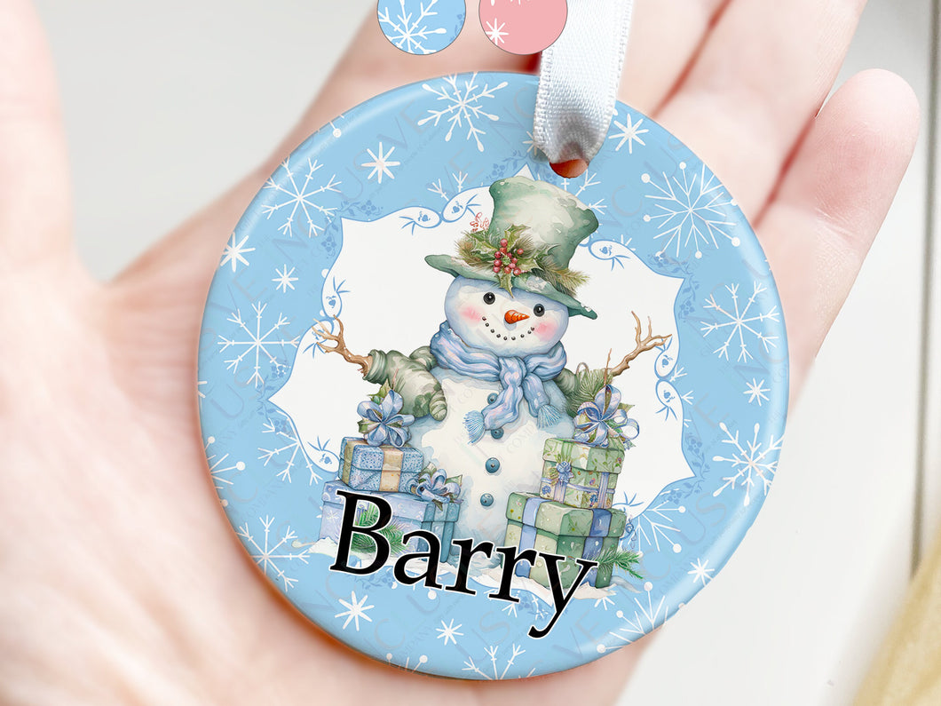 Printed Ceramic Bauble with festive snowman design personalised with any name. 

Snowman is surrounded by brightly wrapped presents and sits on a bluebackground with white snowflakes.