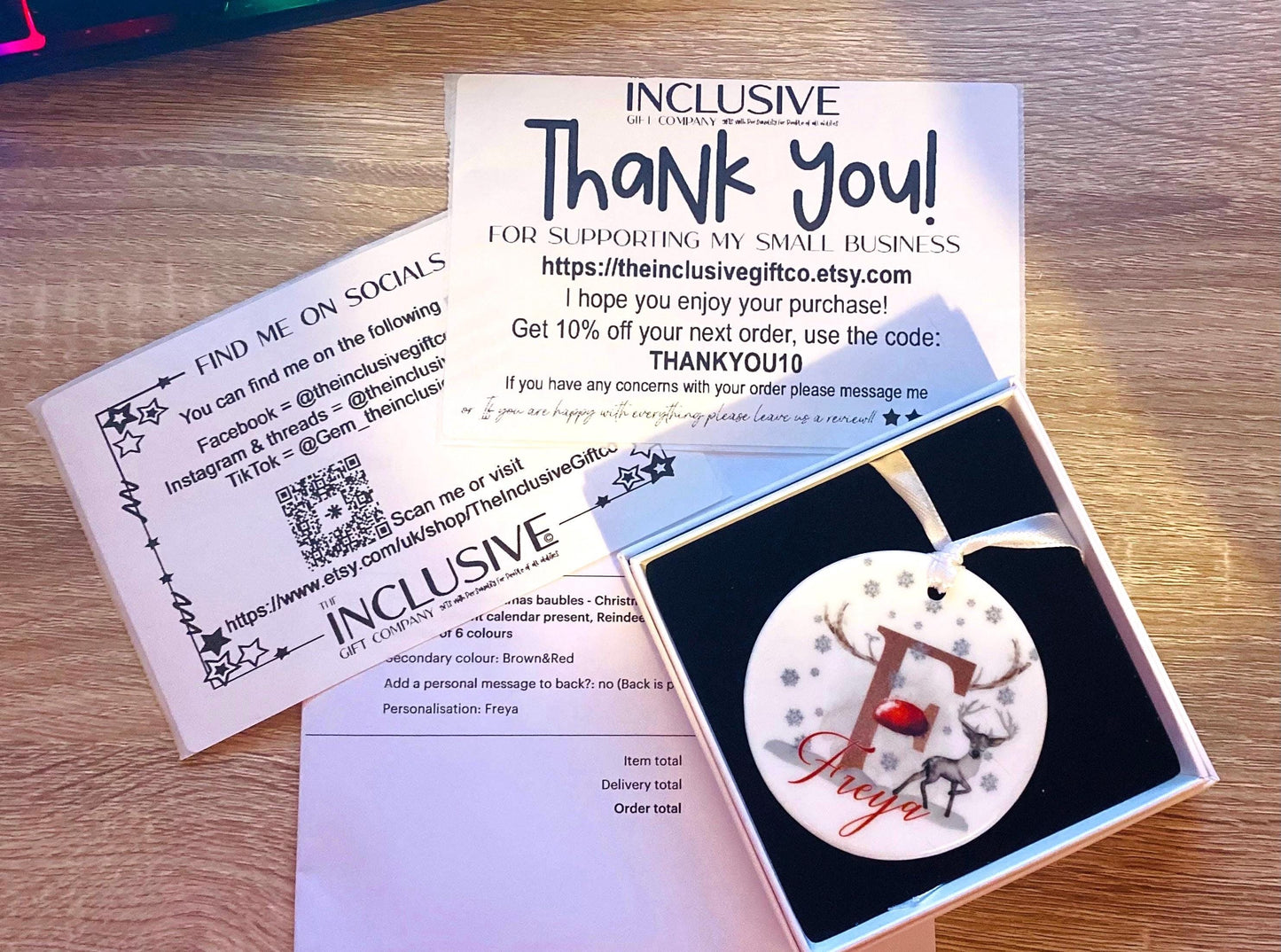 Image shows what to expect in your parcel. 

Ceramic ornament comes with white ribbon attached in a simple square gift box, packing slip, thank you & social media info.